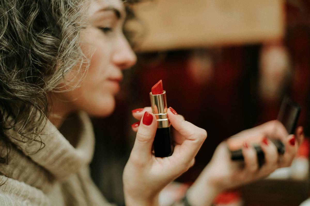 makeup tutorial for women over 50 showing soft-focus blending on mature skin with natural lighting and minimal product layers